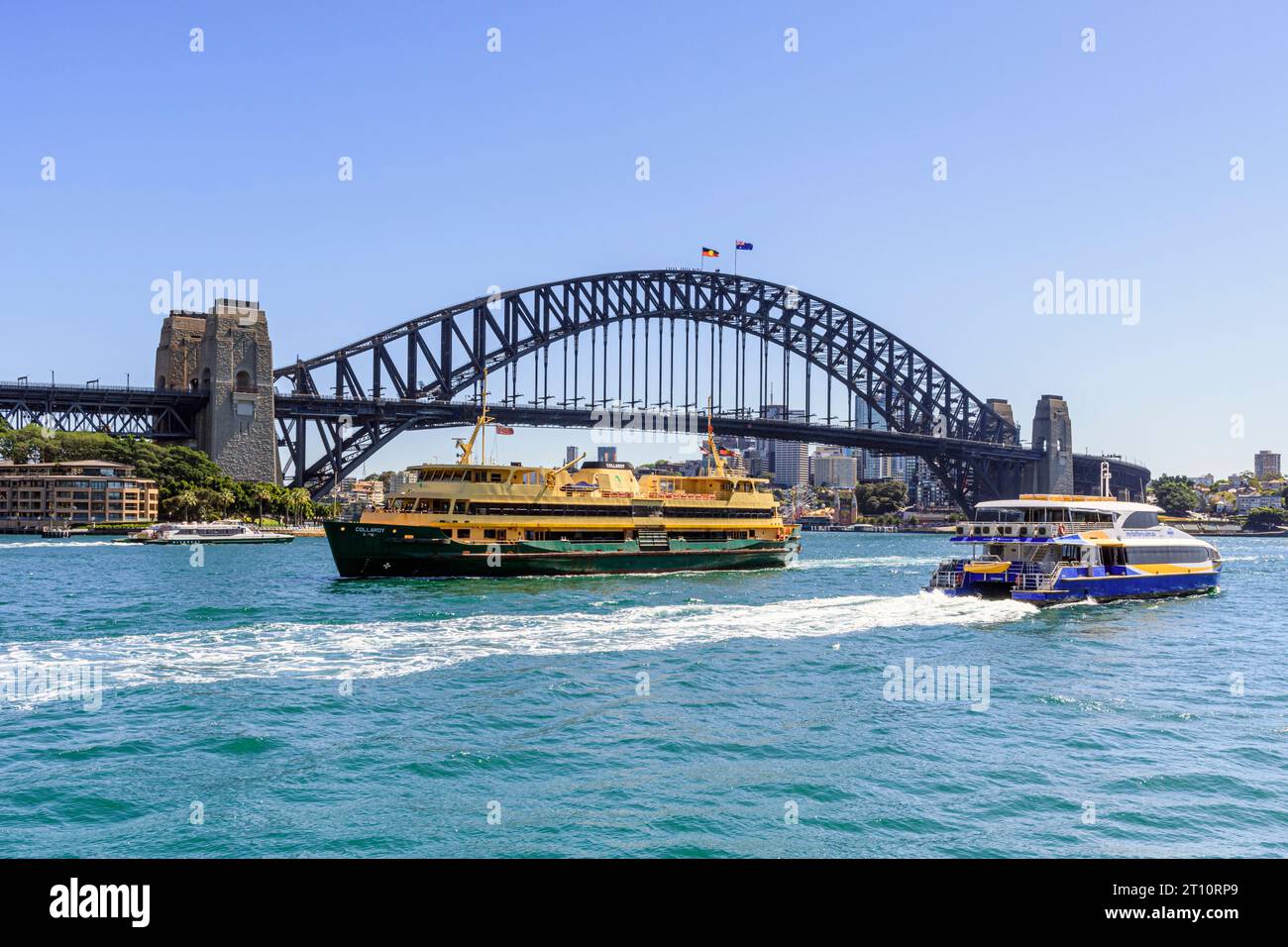 Ferries sail past the steel arches of Sydney Harbour Bridge, Sydney Harbour, Sydney, New South Wales, Australia Stock Photo