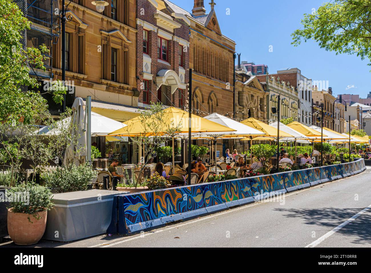Alfresco dining outside restaurants along St in The Rocks area of Sydney, New South Wales