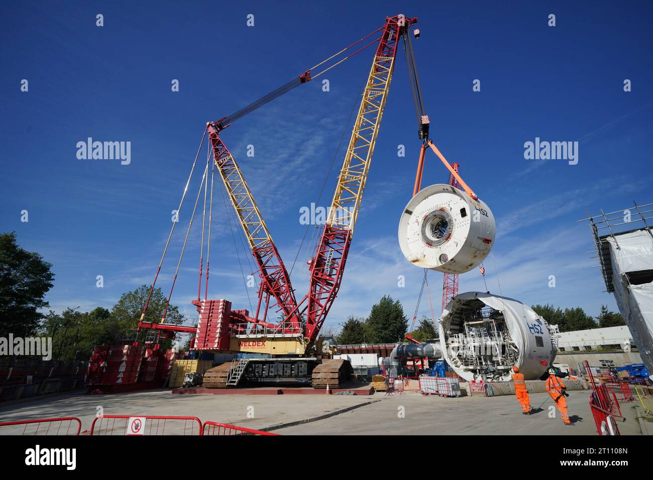 The front shield from the 2,000-tonne tunnel boring machine (TBM), as yet unnamed, is lifted into the Victoria Road Crossover Box ancillary shaft at the HS2 site, near to Old Oak Common in west London. Picture date: Tuesday October 10, 2023. Stock Photo