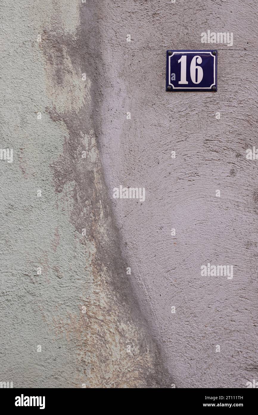 Gray greenish old shabby cracked cement wall with the classical design