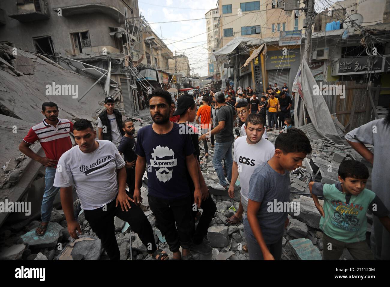 Khan Yunis, Gaza. 10th Oct, 2023. Palestinians inspect the destruction following Israeli airstrikes on a market in residential neighbourhood in Khan Younis, southern Gaza Strip on Tuesday October 10, 2023, early on October 10, 2023. Israel kept up its deadly bombardment of Hamas-controlled Gaza. Photo by Ismael Mohamad/UPI. Credit: UPI/Alamy Live News Stock Photo