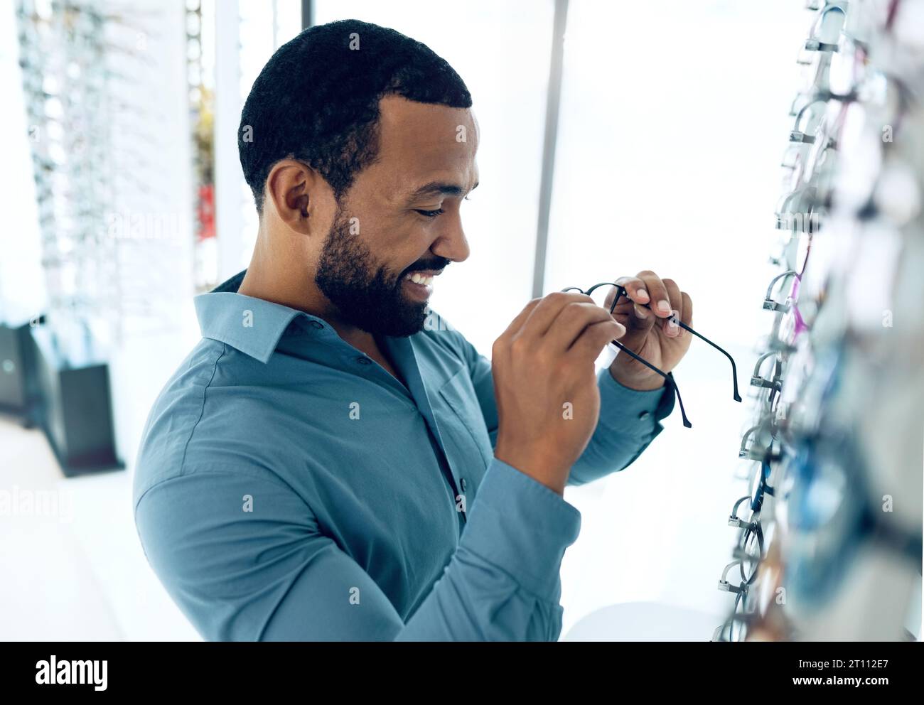 Optometry, happy and man with glasses for decision, choice and eye care ...