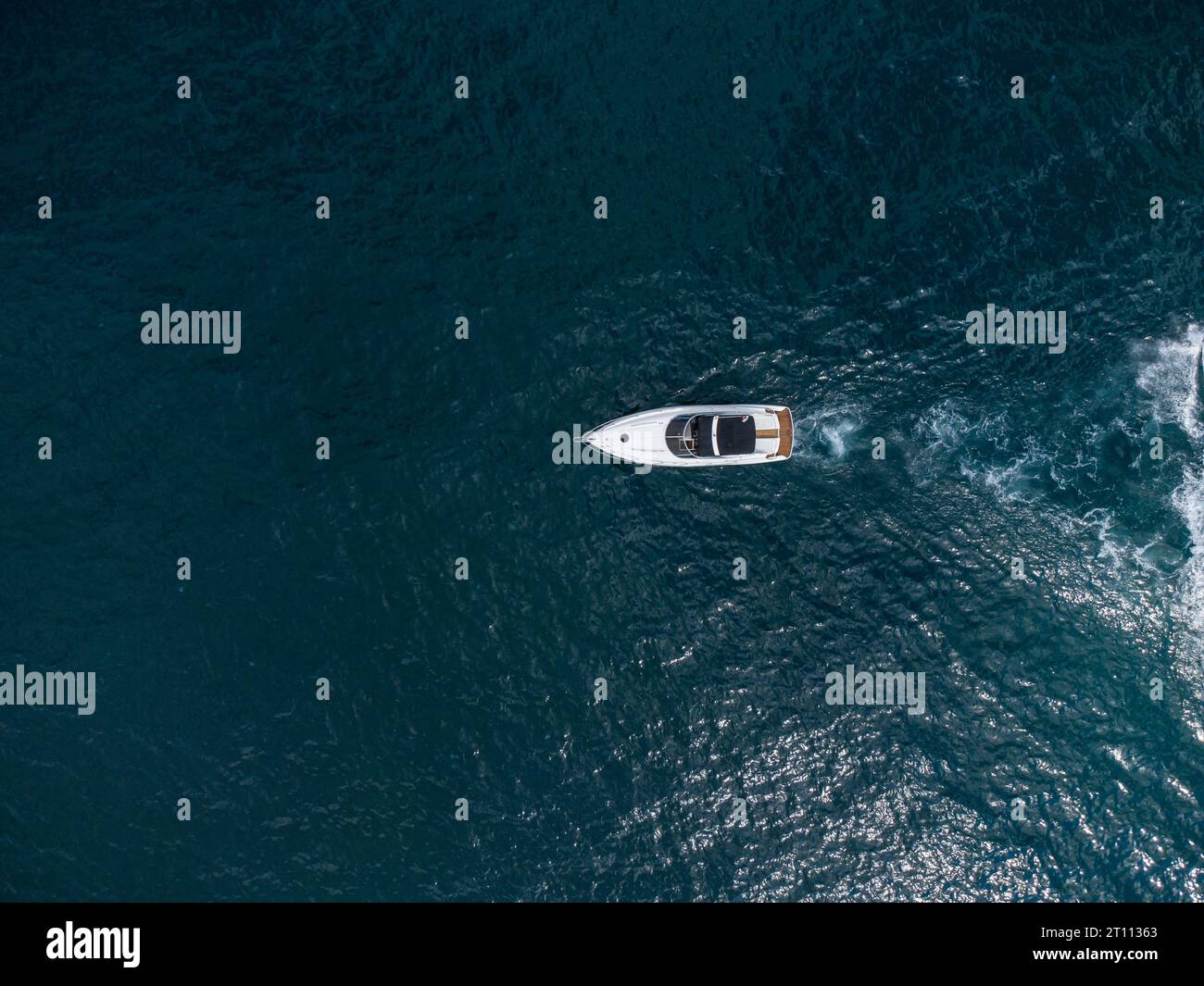 Aerial top down view of speed motor boat on open blue sea Stock Photo ...
