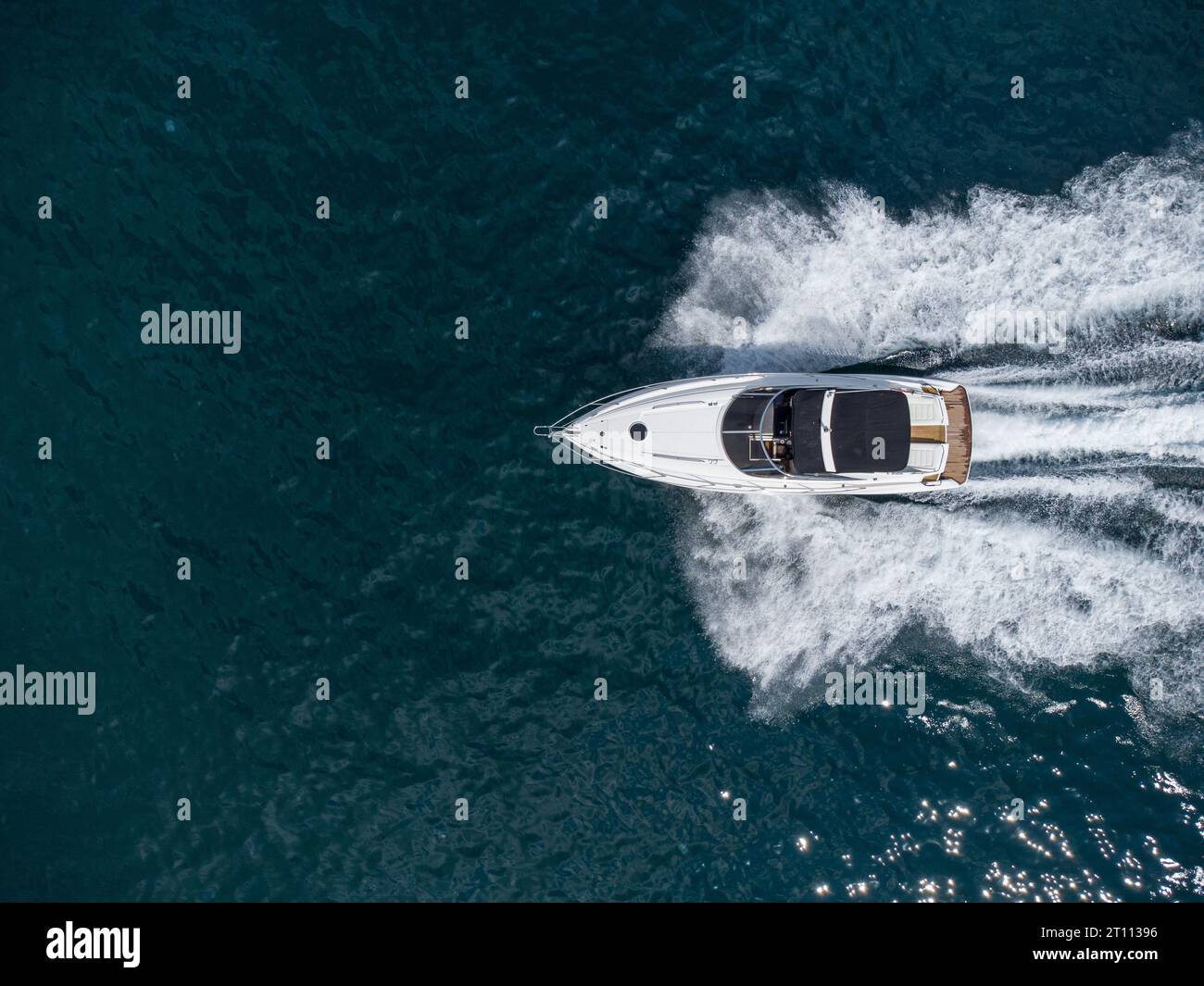 Aerial top down view of speed motor boat on open blue sea Stock Photo ...
