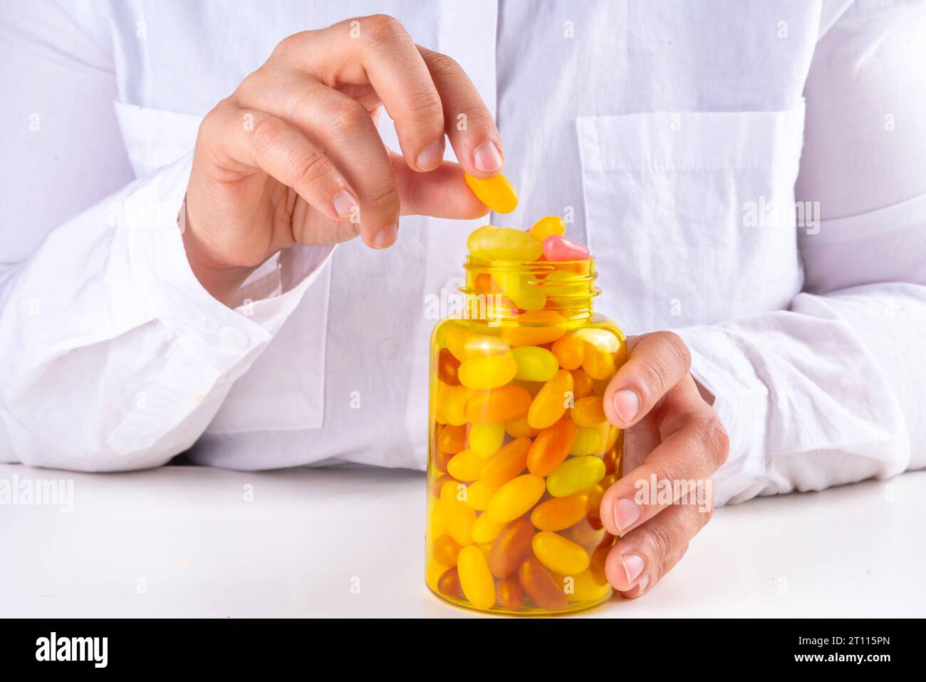 Gummy Vitamins and supplement for adults. Woman eats sweet jelly multivitamin candy