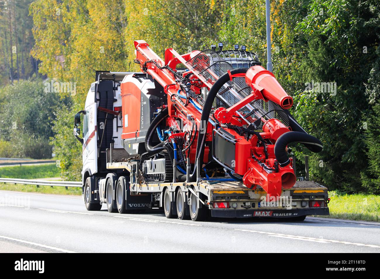 Volvo FH 500 truck MHL Trans transports Sandvik Leopard DI450 Down The Hole Drill Rig on trailer on road 25. Raasepori, Finland. September 22, 2023. Stock Photo