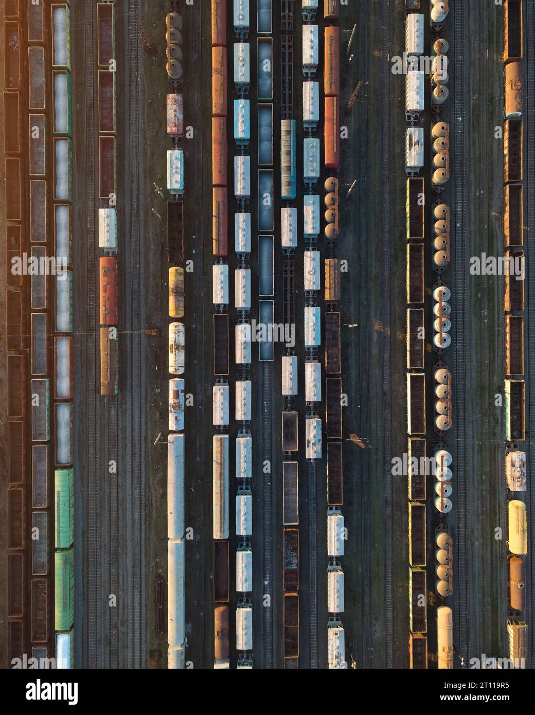 Aerial top view of railway wagons. Cargo trains at sunset Stock Photo ...
