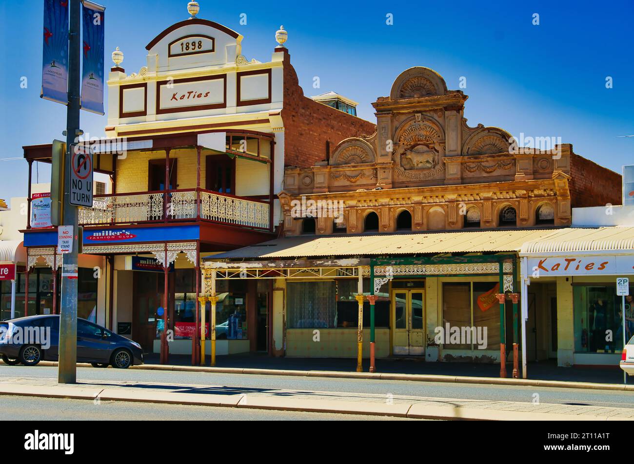 Two heritage buildings, painted in pastel colours, from around 1900 on Hannan Street, Kalgoorlie, Western Australia Stock Photo