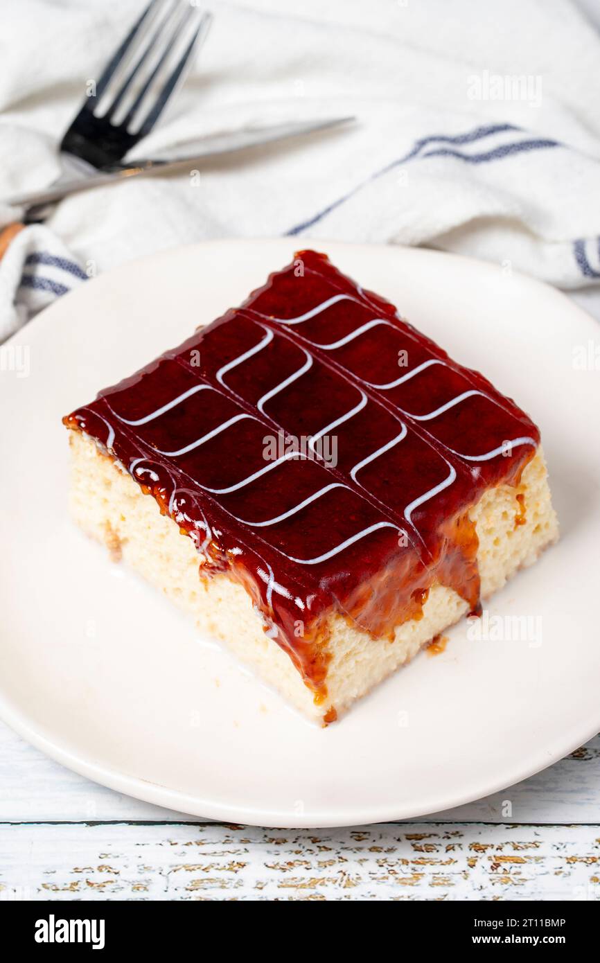 Tres leches cake. Slices of trilece cake with milk and caramel on a wooden background. patisserie products. Close up Stock Photo