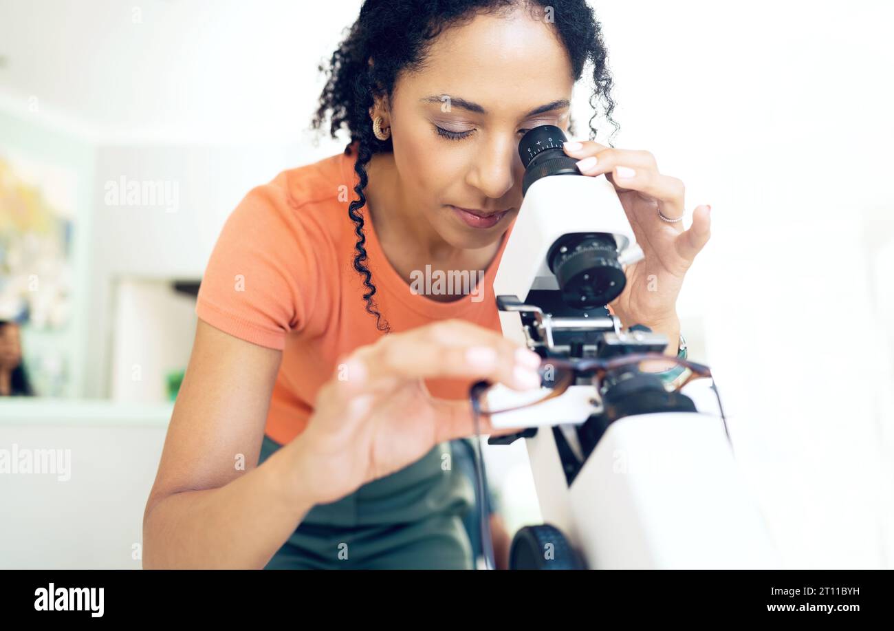 Optometrist, woman on microscope and glasses for calibration, exam and