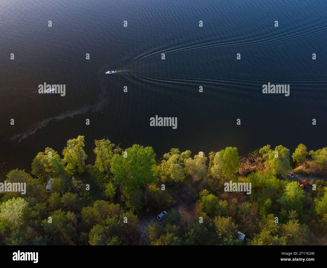 Aerial top view of a boat sailing in the lake Stock Photo - Alamy