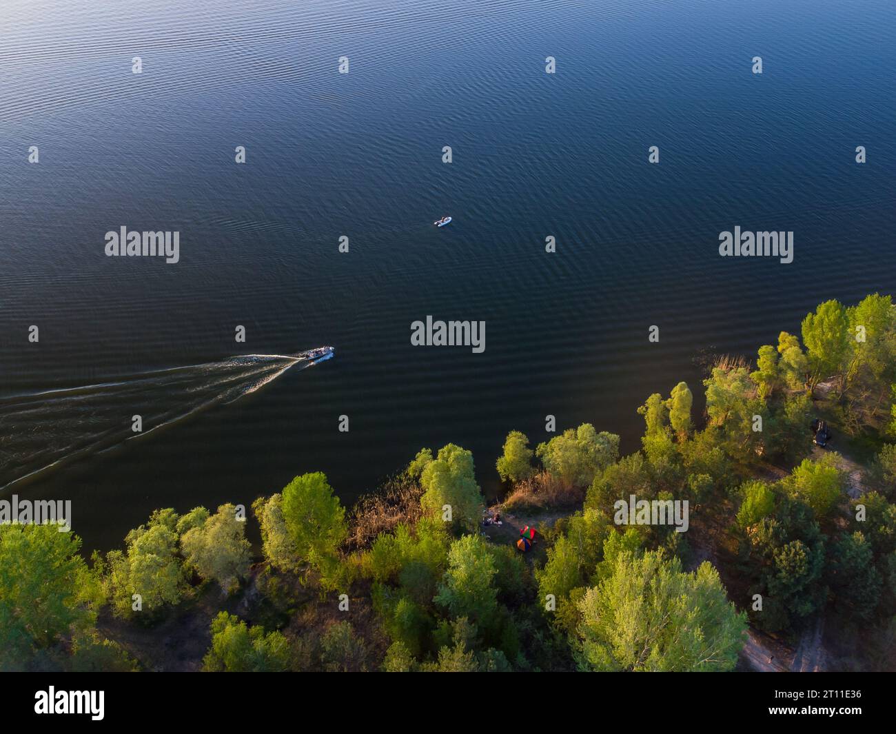 Aerial top view of a boat sailing in the lake Stock Photo - Alamy