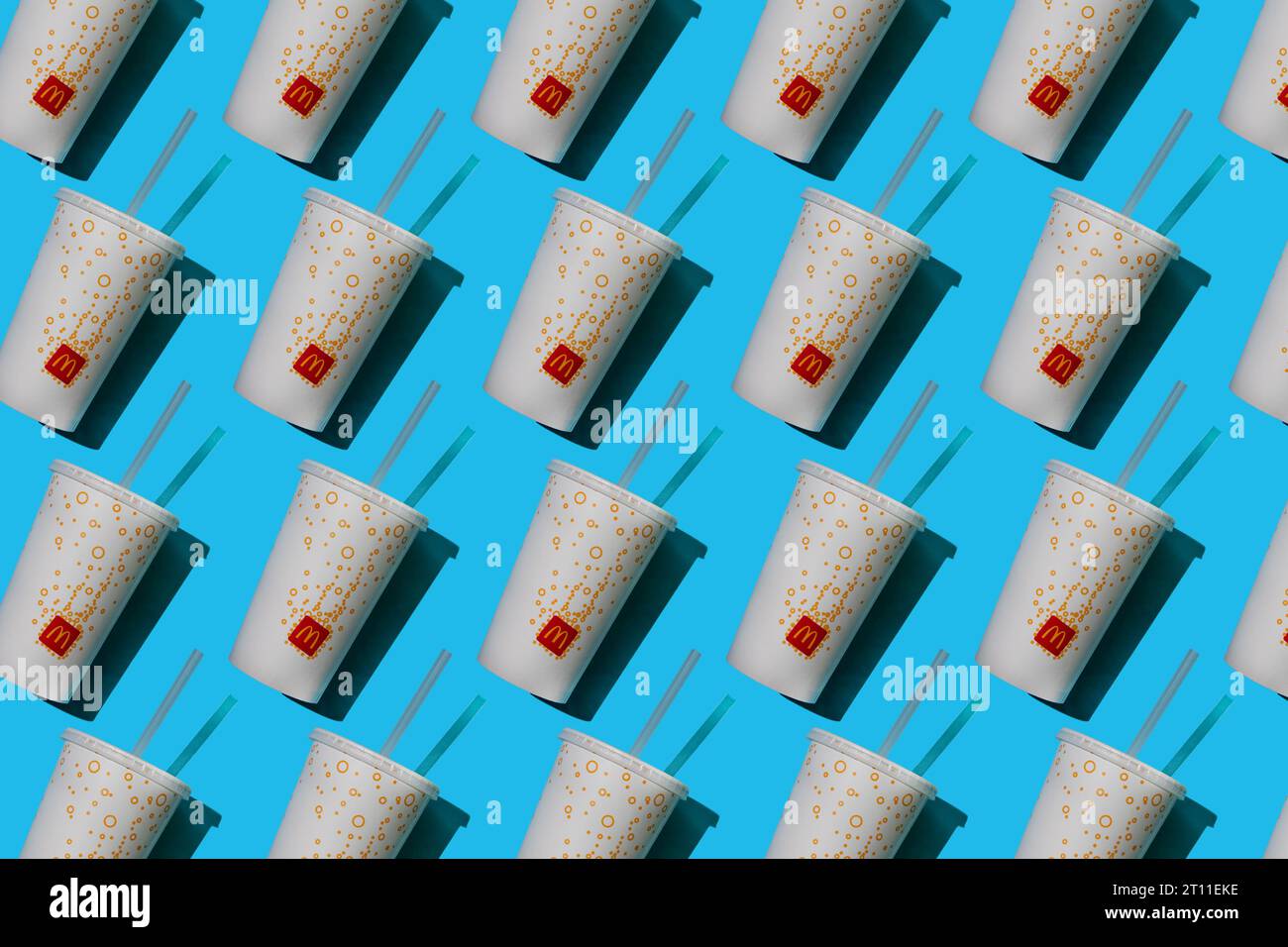 Yellow glass of McDonald's. Paper cup with lid. Takeaway drink ...