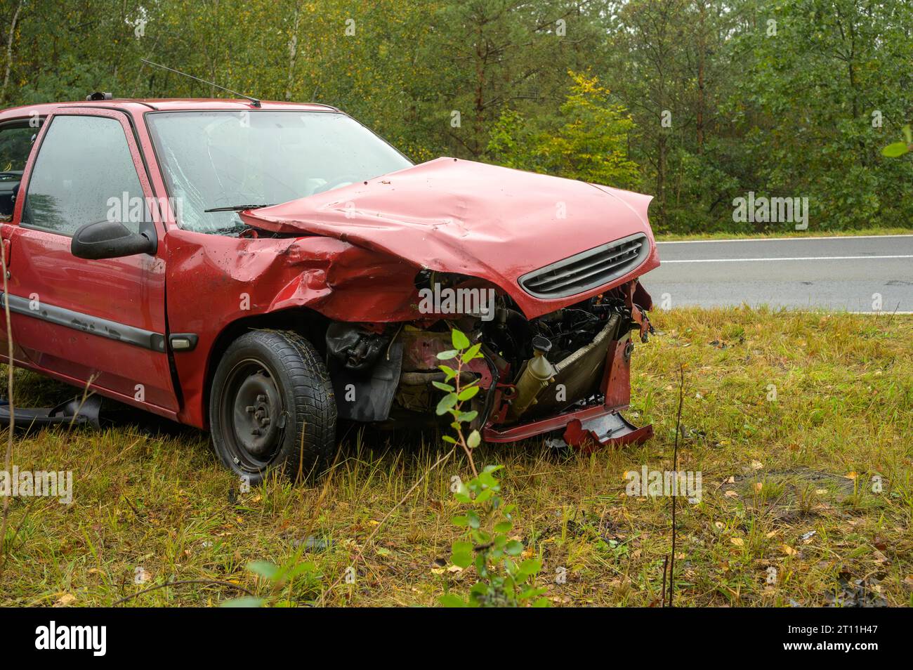 An accident car stands next to the road Stock Photo