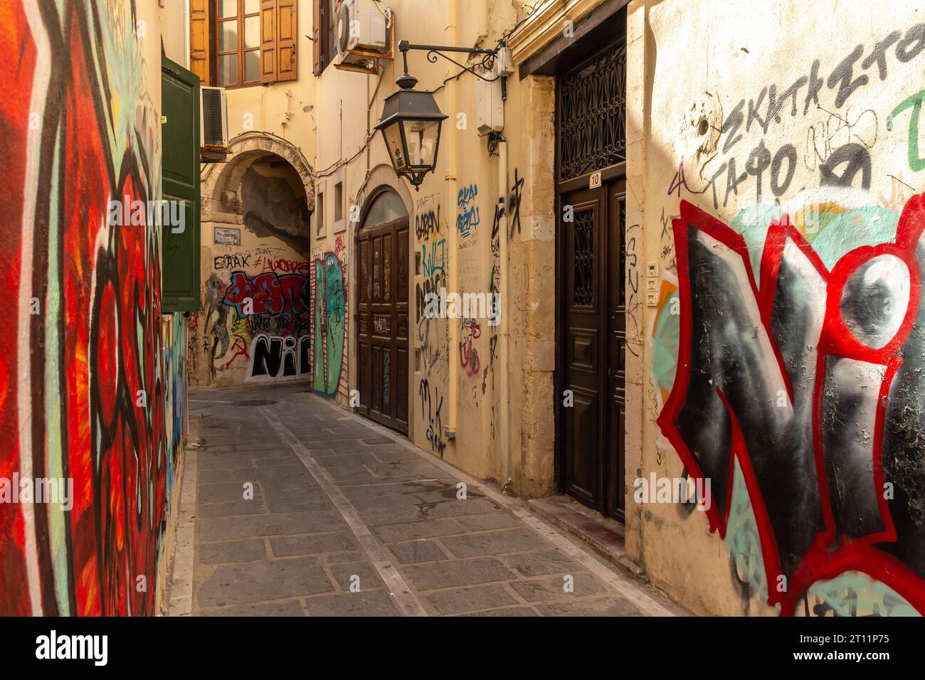 Back alleys and graffiti in a Greek city. Rethymno old town, Crete ...