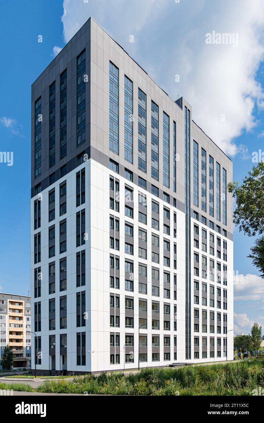 New building facade in housing complex. Modern style in architecture ...