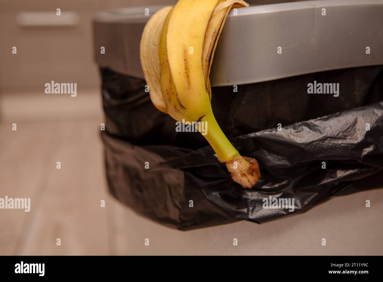 banana peel in a trash bin Stock Photo Alamy