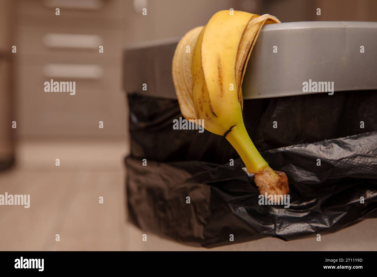 banana peel in a trash bin Stock Photo Alamy