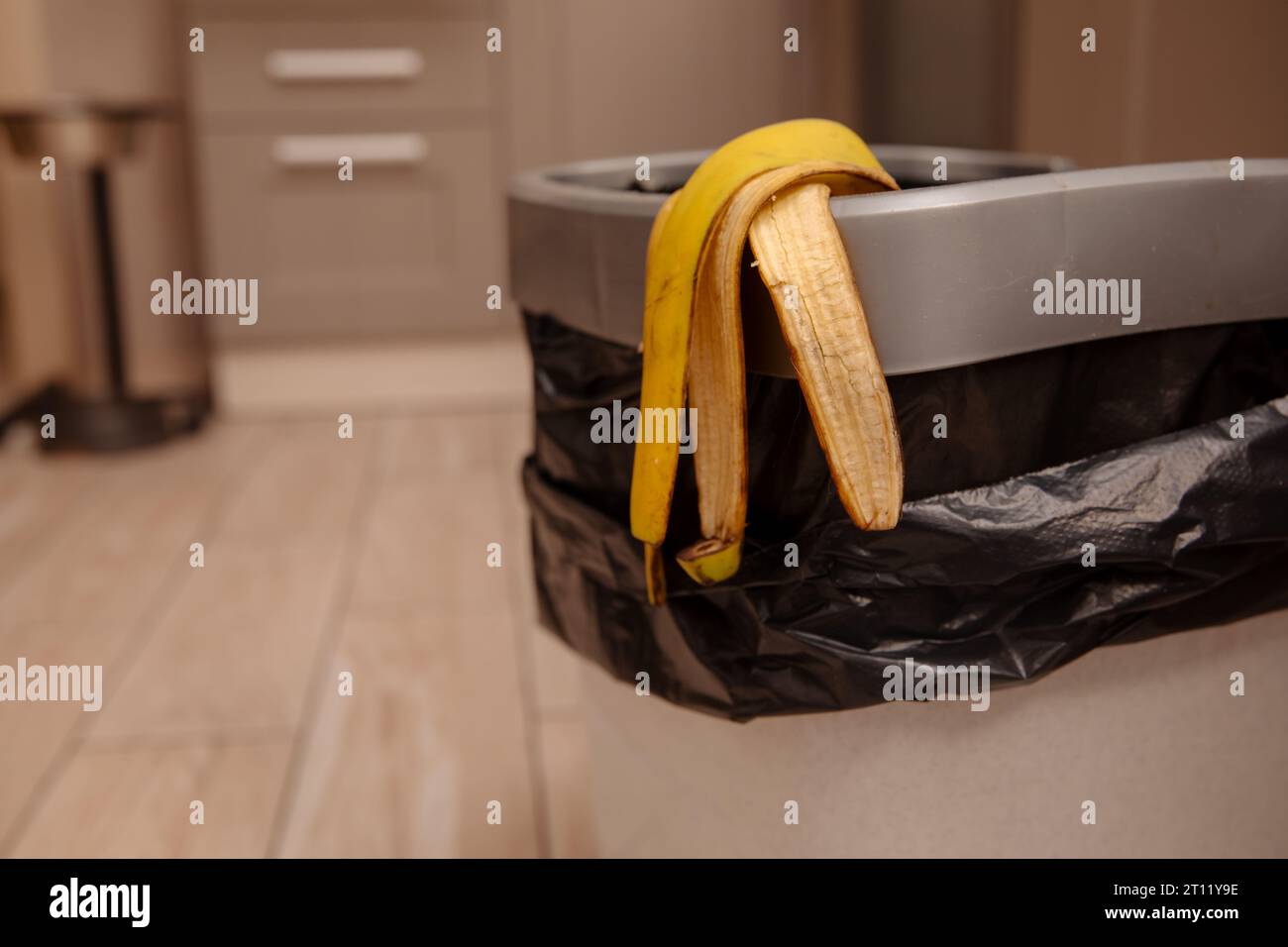 banana peel in a trash bin Stock Photo Alamy