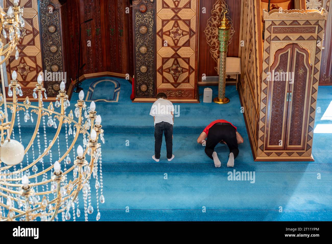 Kid praying with adult hi-res stock photography and images - Alamy
