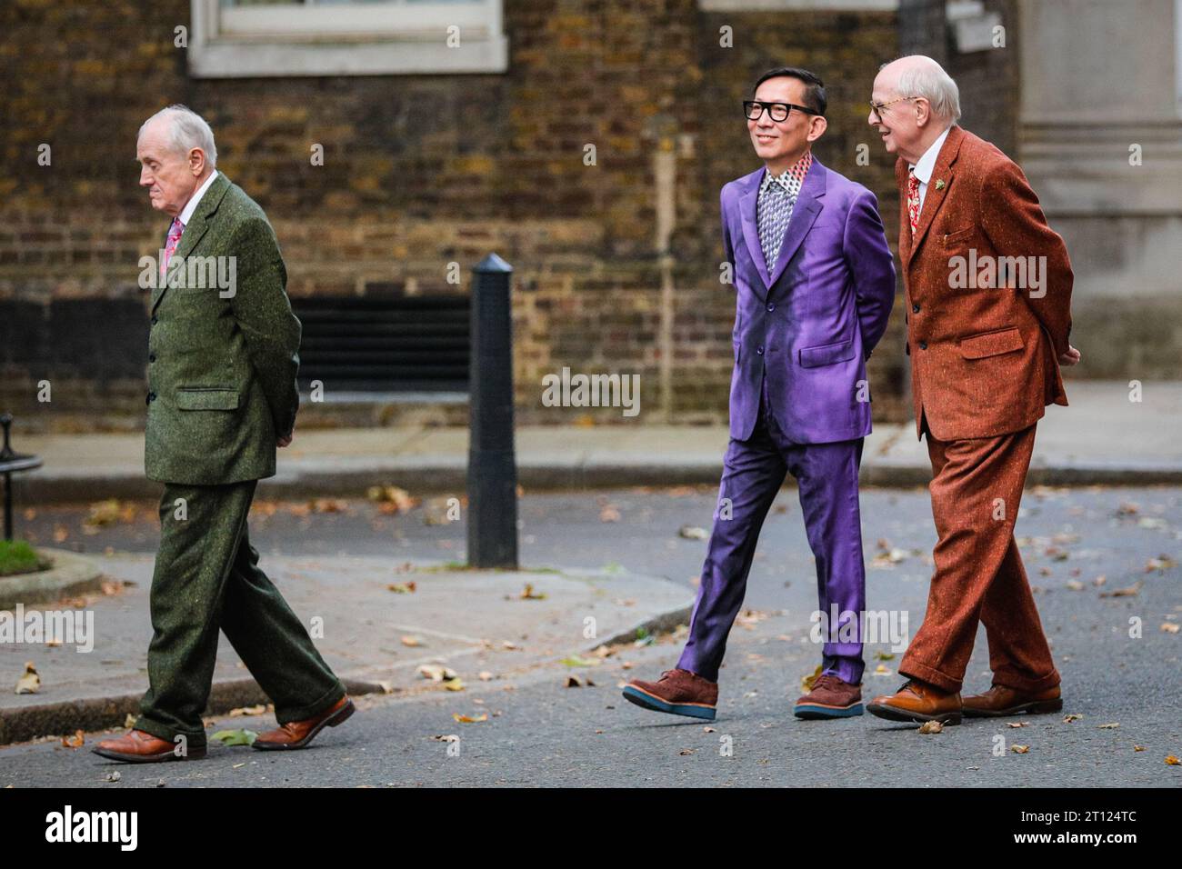 London, UK. 10th Oct, 2023. British artist duo Gilbert and George (Gilbert Prousch, sometimes referred to as Proesch, and George Passmore) attend a reception at 10 Downing Street with an associate (middle) to celebrate 20 years of Frieze London Art Fair. They arrive together with other invitees. Frieze 2023 will officially start tomorrow with its preview day. Credit: Imageplotter/Alamy Live News Stock Photo