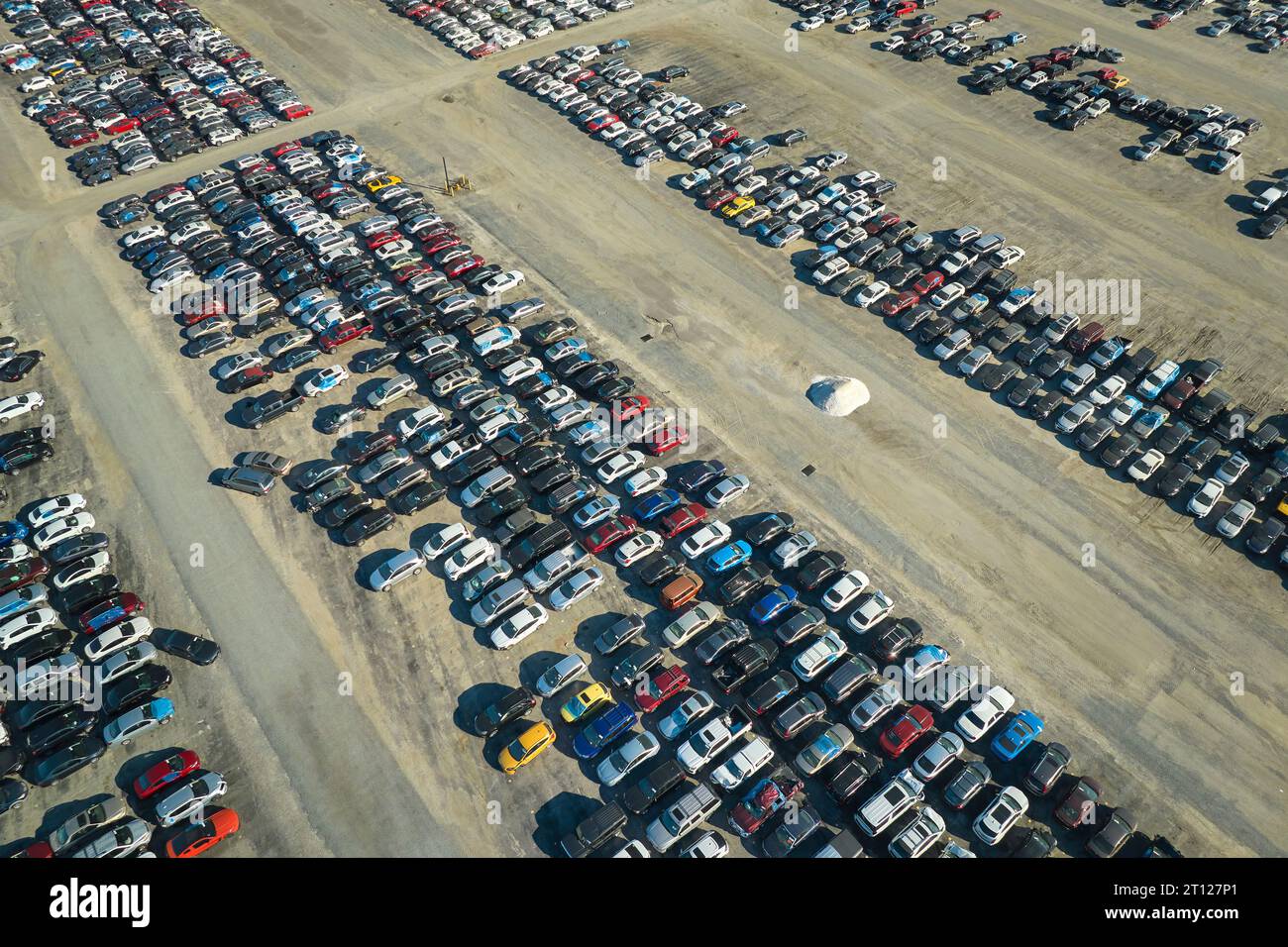 Aerial view of auction reseller company big parking lot with parked cars ready for remarketing services. Sales of secondhand vehicles Stock Photo