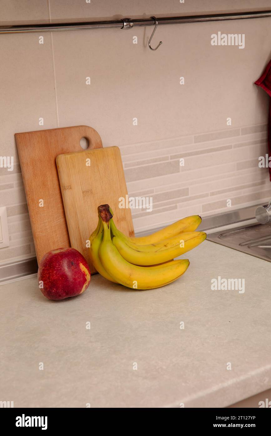 Kitchen Scene with Bananas and Mixed Fruits Stock Photo
