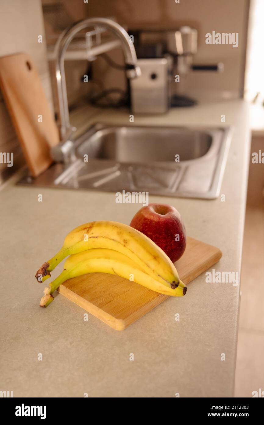 Kitchen Scene with Bananas and Mixed Fruits Stock Photo