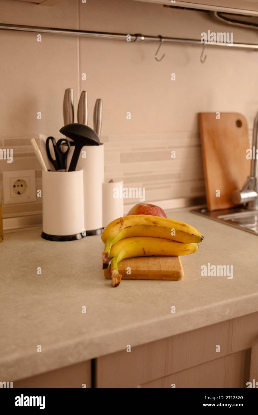 Kitchen Scene with Bananas and Mixed Fruits Stock Photo