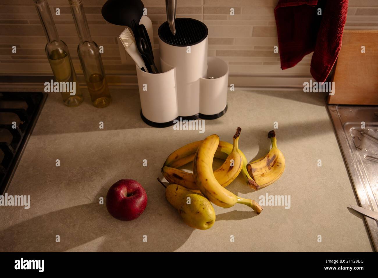 Kitchen Scene with Bananas and Mixed Fruits Stock Photo