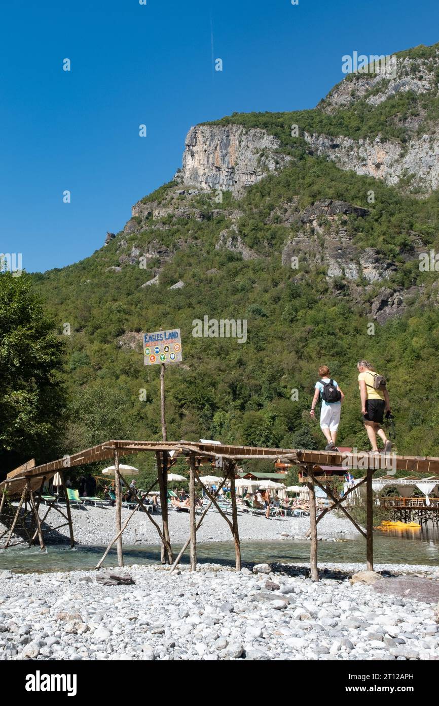 Makeshift wooden bridge over water Stock Photo - Alamy