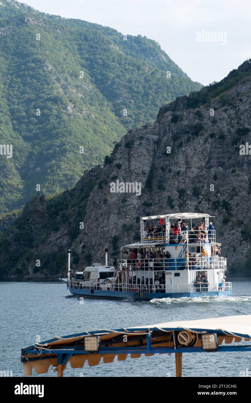 The port and boats at Lake Komani, Albania Stock Photo