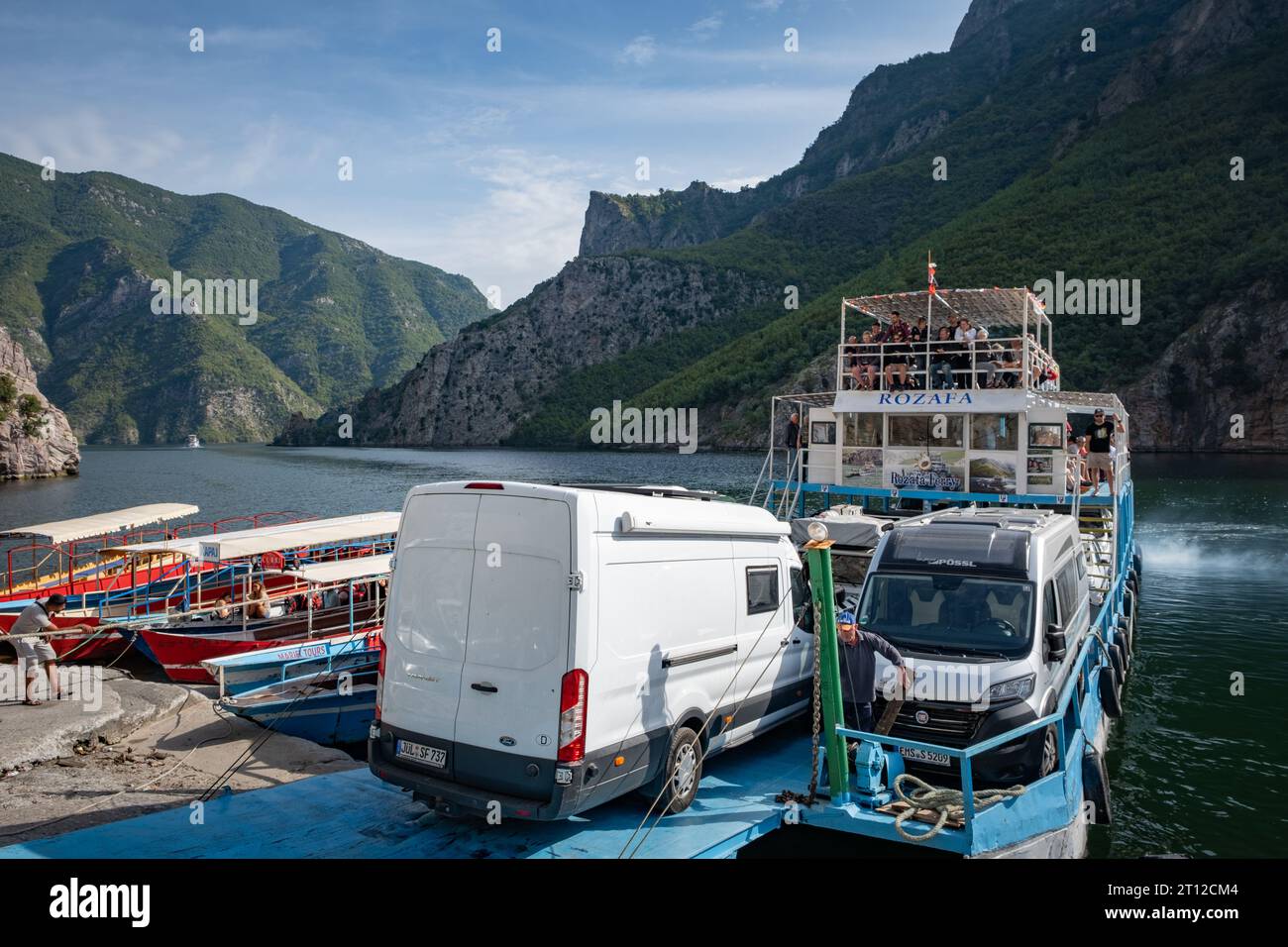 The port and car ferry boats at Lake Komani, Albania Stock Photo