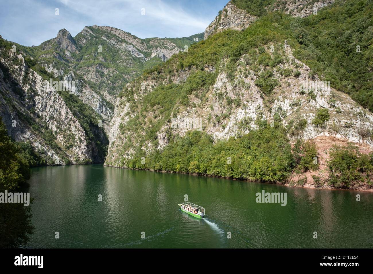 A tourist tour boat on the water at Lake Komani, Albania Stock Photo
