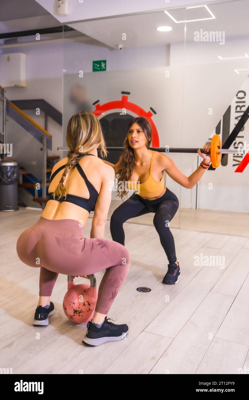 Fit woman doing deep squats Stock Photo - Alamy