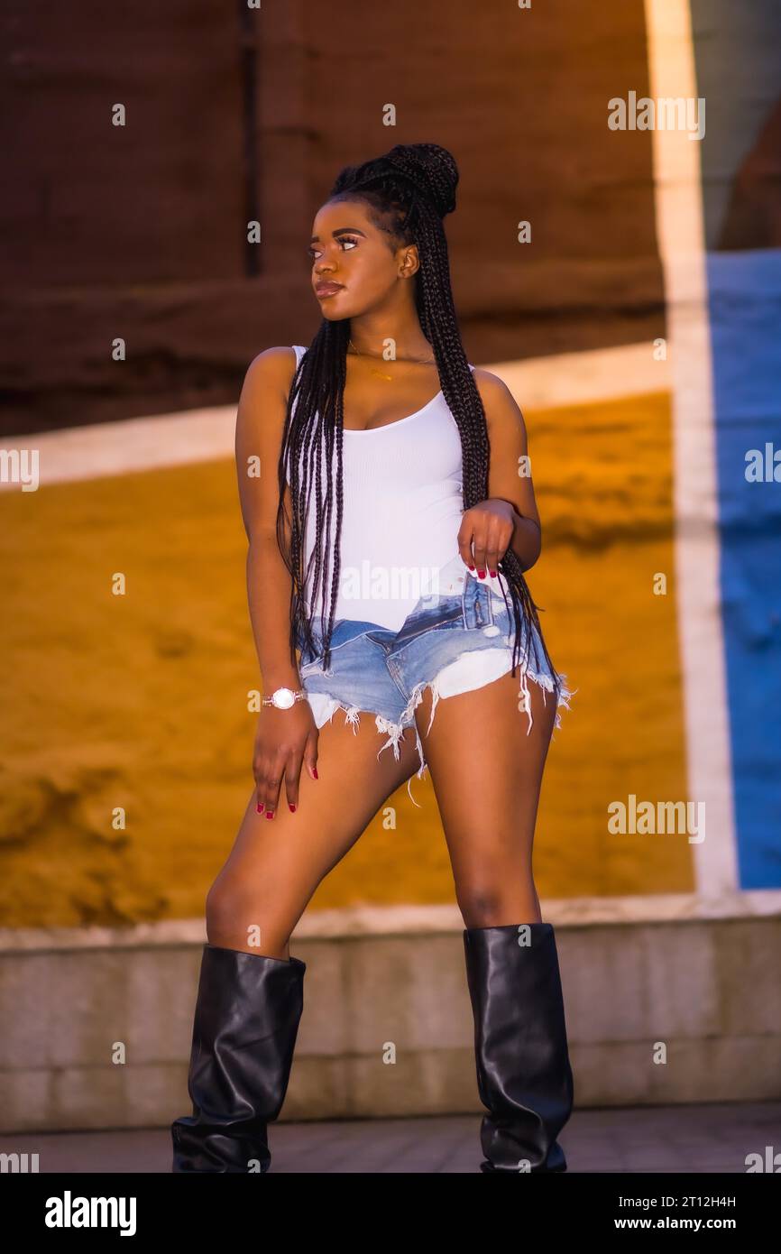 Fashionable urban style with an African girl with braids on a street in ...