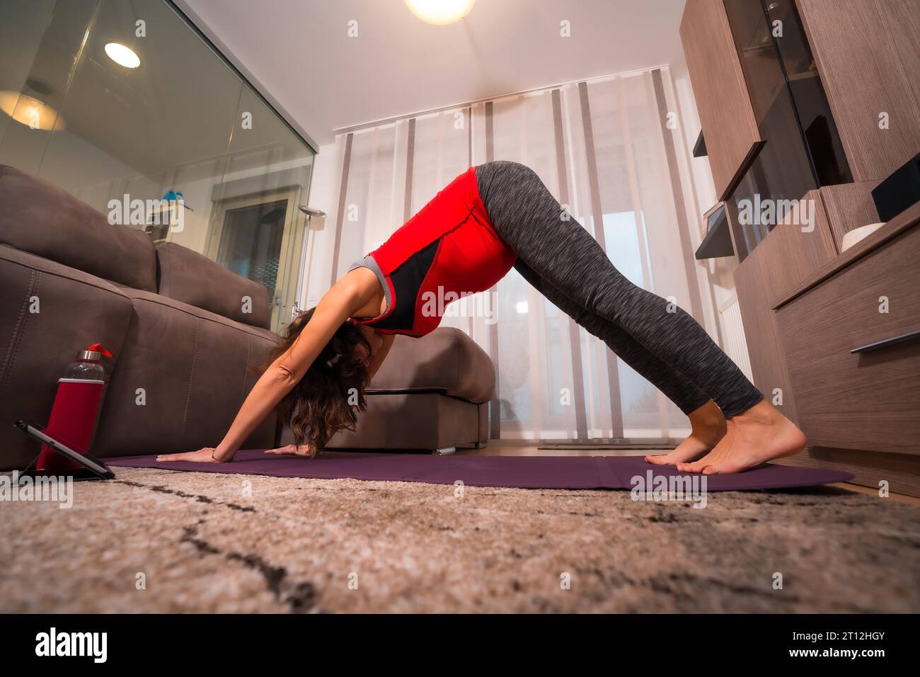 Women doing pilates exercises lying on pilates workout machines