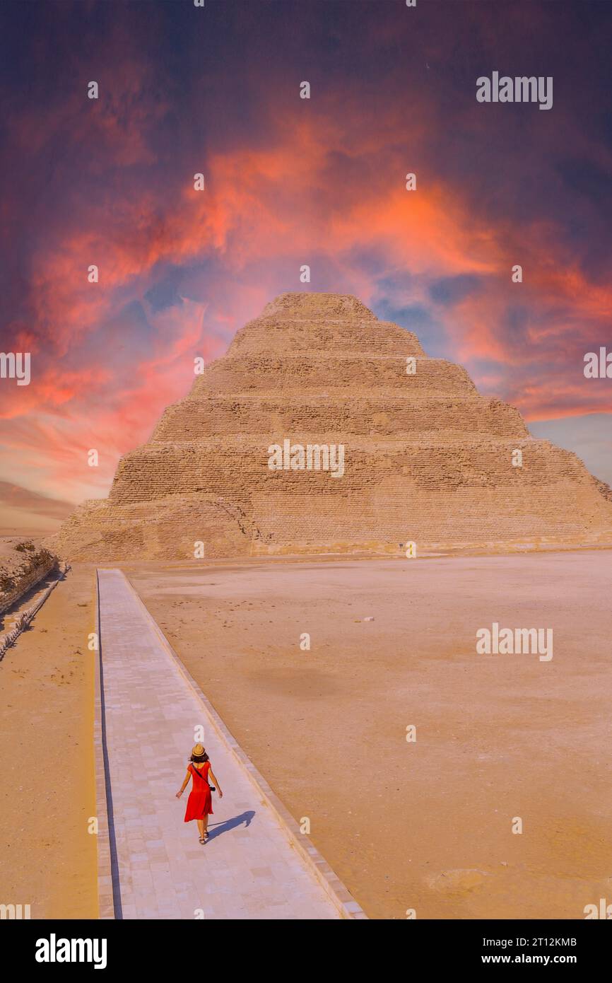 A young woman visiting the Stepped Pyramid of Djoser, Saqqara. Egypt ...