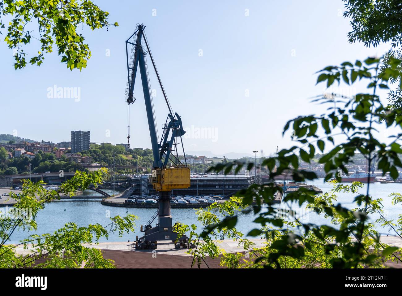 Crane of the port of Pasajes in the municipality of Lezo, the small coastal town in the province of Gipuzkoa, Basque Country. Spain Stock Photo