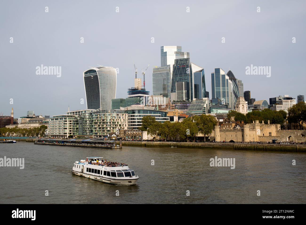 City of London Skyline and Tourist Boat River Thames  London Stock Photo