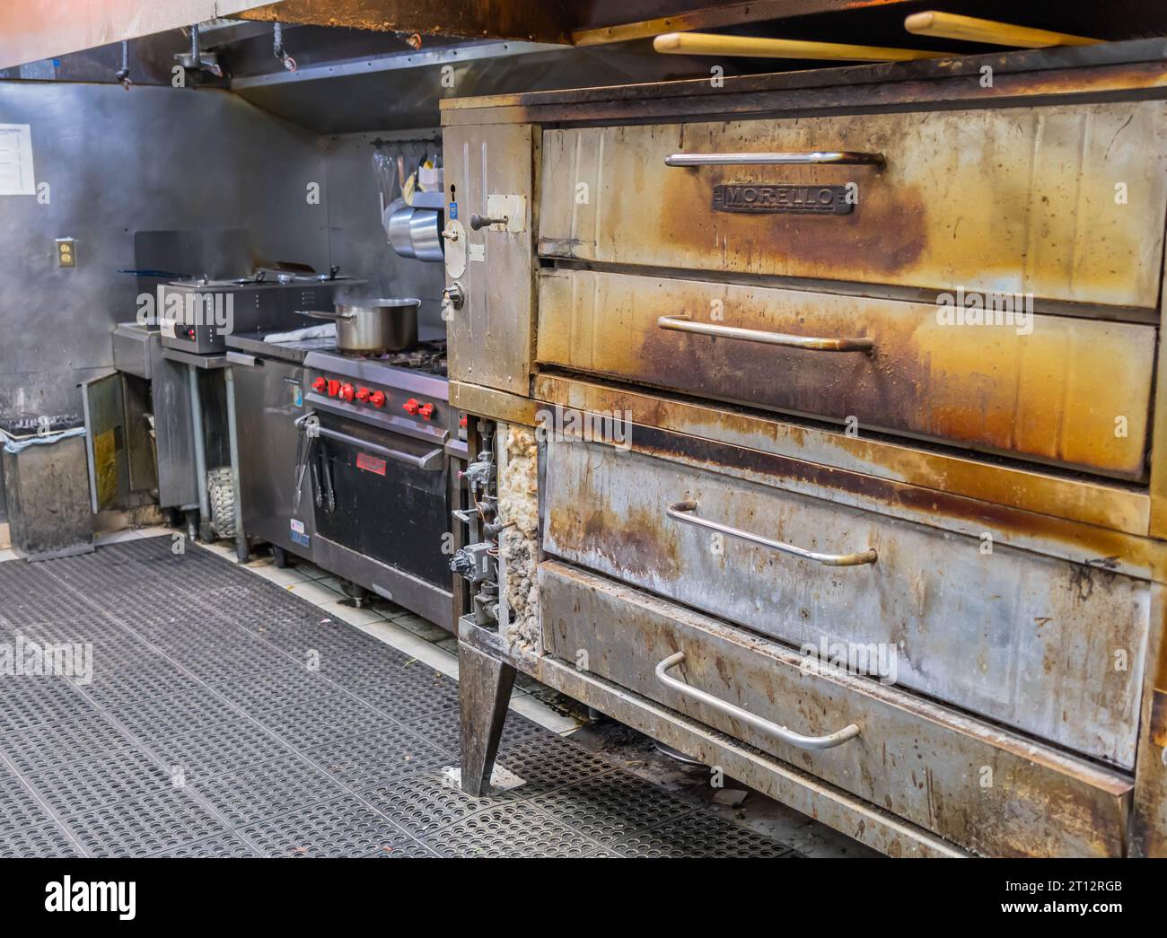 Pizza ovens, a stove and deep fryer in a pizza shop in Monroeville, Pennsylvania, USA Stock Photo