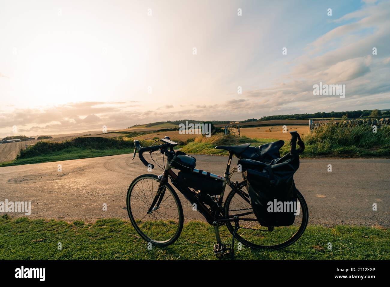 Traveller on bicycle. Solo travel long distance bicycle touring concept