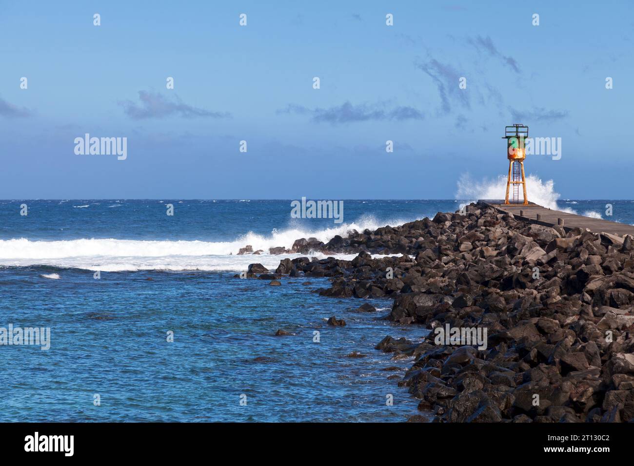 The lighthouse of Saint-Pierre at the end of the jetty in front of the ...