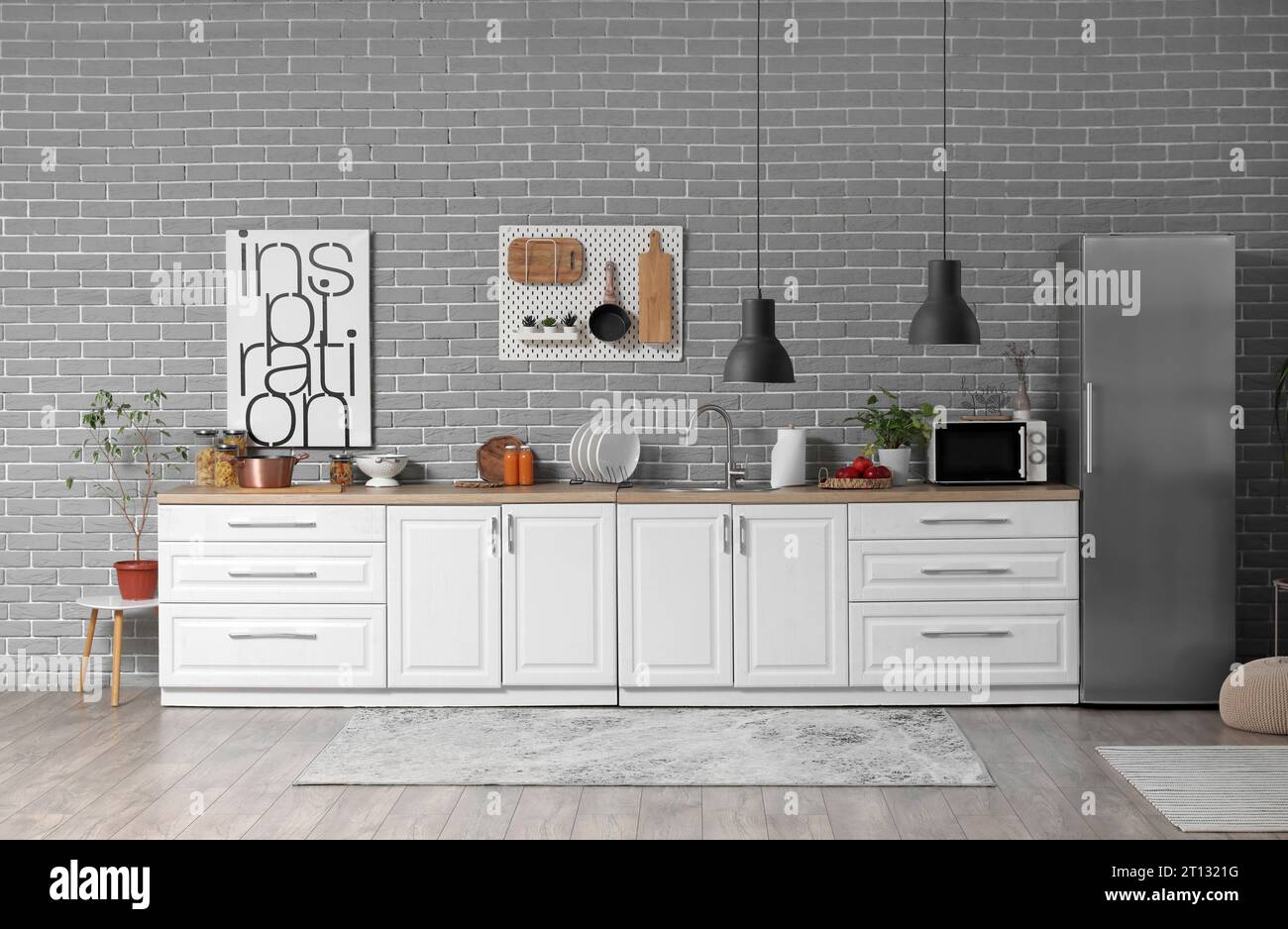 Interior of modern kitchen with white counters and fridge Stock Photo ...