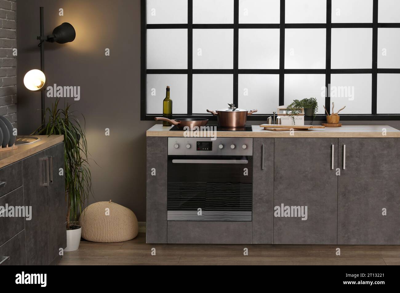 Interior of modern kitchen with grey counters and electric oven Stock ...