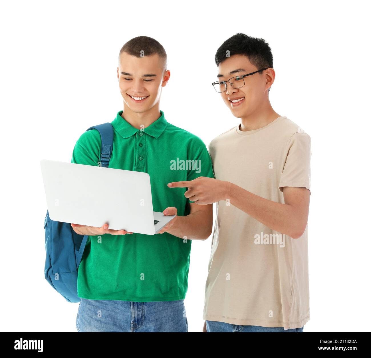 Happy male students with notebooks and laptop isolated on white ...
