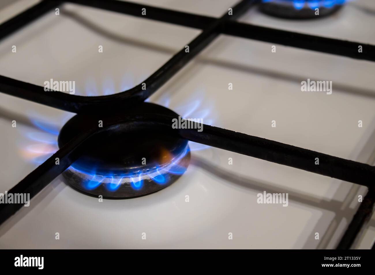 Woman turning on the gas burner on the stove Stock Photo Alamy