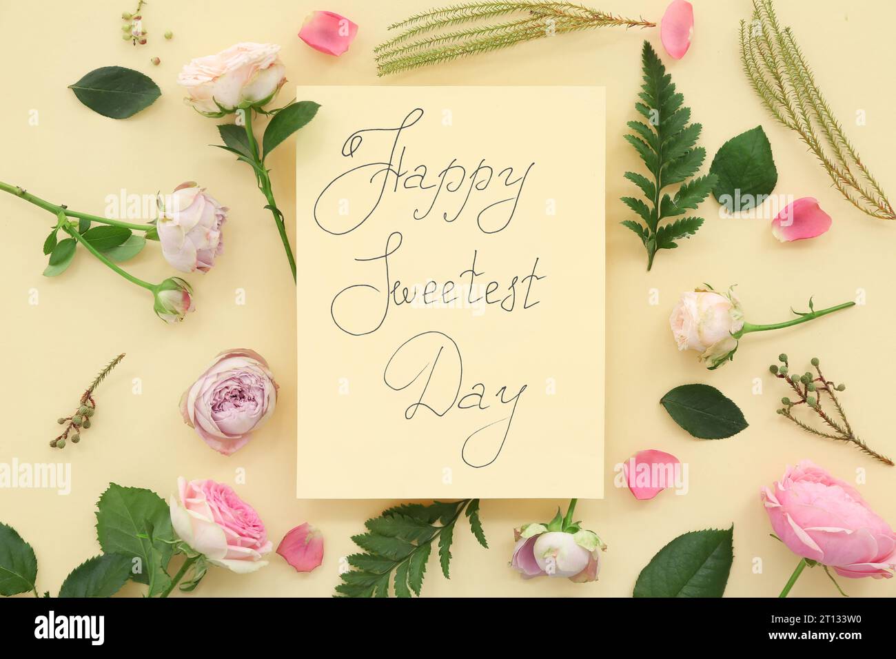 Greeting card with text HAPPY SWEETEST DAY and rose flowers on yellow