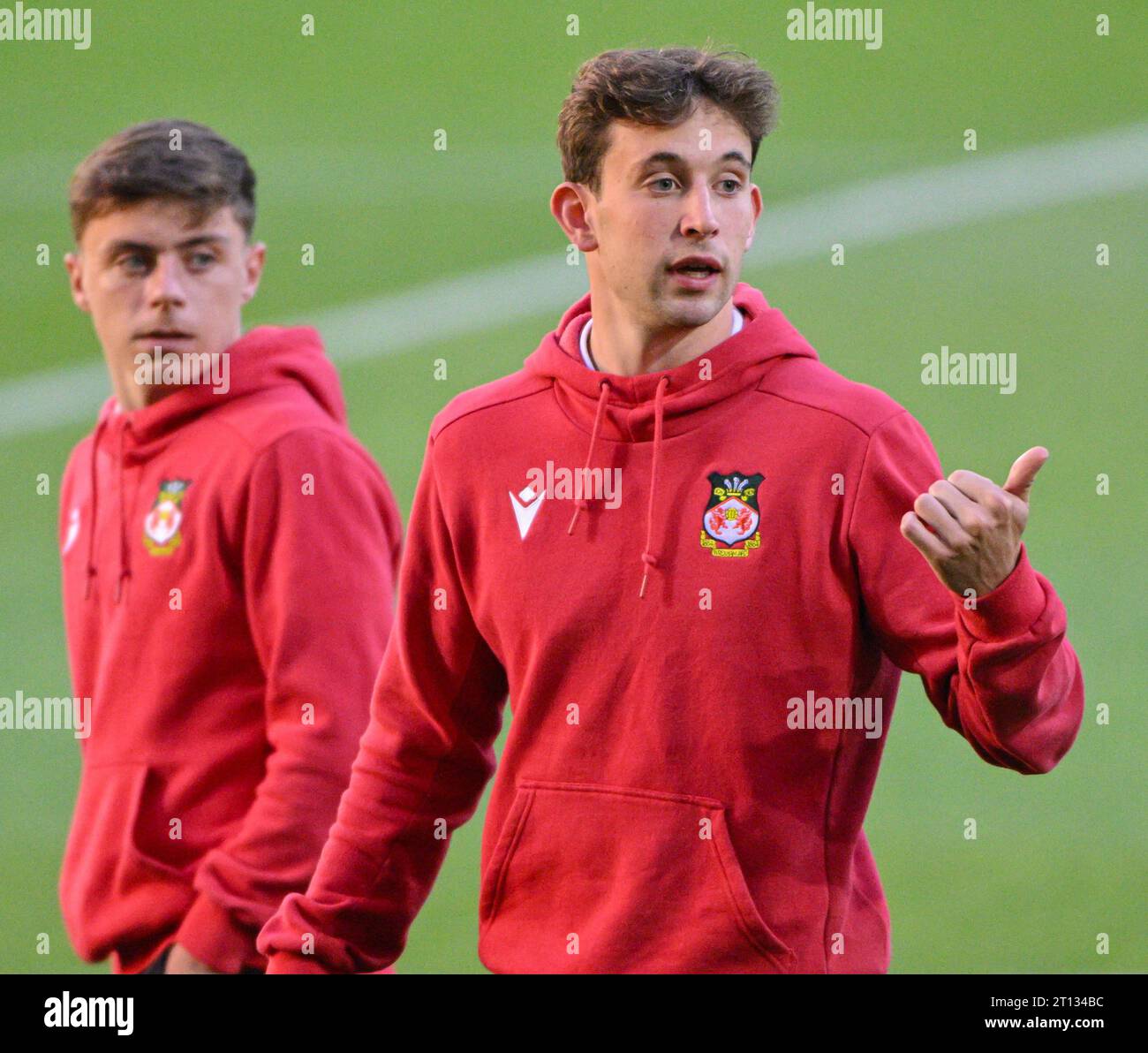 Aaron James 34 of Wrexham Football Club inspects the pitch ahead of
