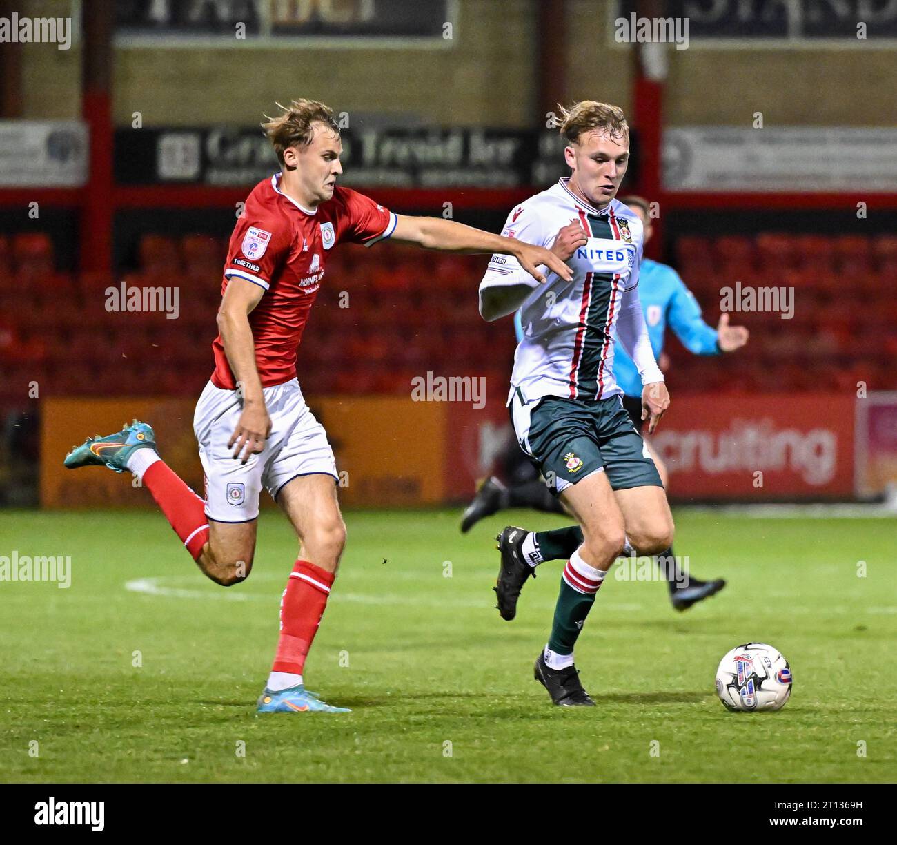 Jake Bickerstaff 27 of Wrexham Association Football Club and Zac Williams 4 of Crewe Alexandra
